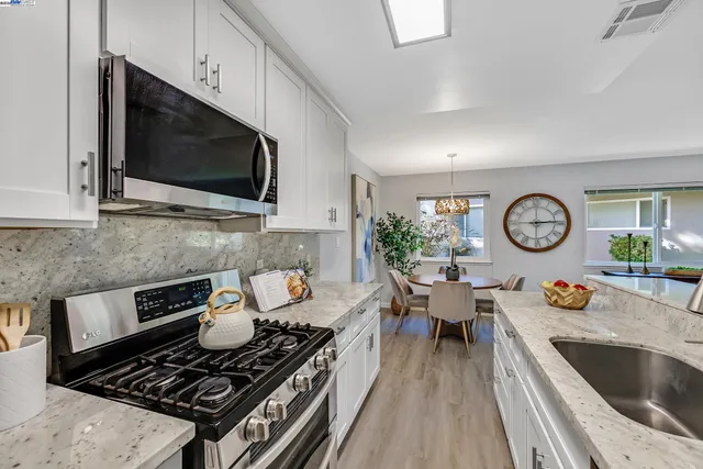 a kitchen with a stove and a microwave