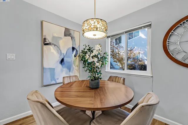 a dining room with table and chairs