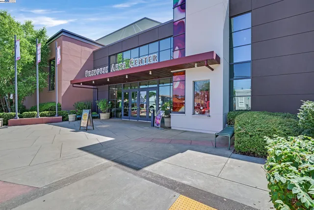 a view of a building with sitting area