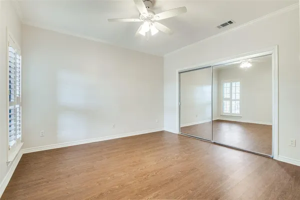 a bathroom with a sink a toilet and a large mirror