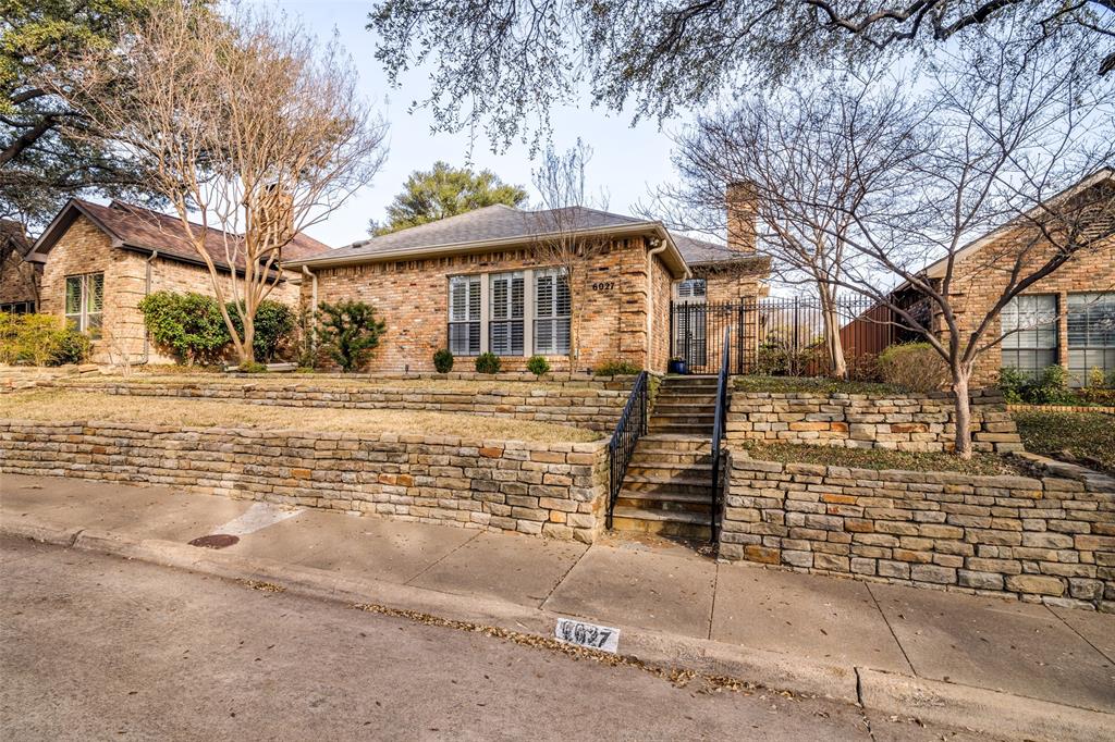 6027 High Court Place Dallas, TX 75254 - Photo 2 of 26 a front view of a house with a yard