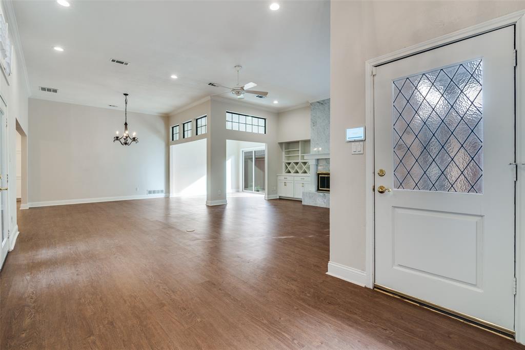 6027 High Court Place Dallas, TX 75254 - Photo 4 of 26 a view of a hallway with wooden floor