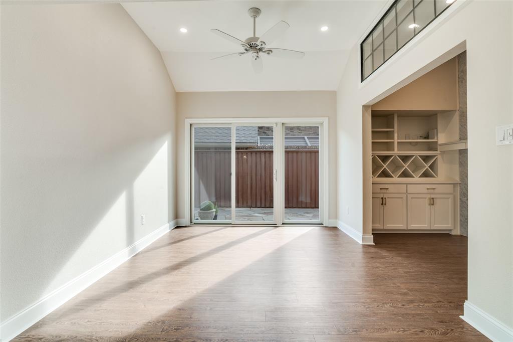 6027 High Court Place Dallas, TX 75254 - Photo 10 of 26 a view of a livingroom with wooden floor and a ceiling fan