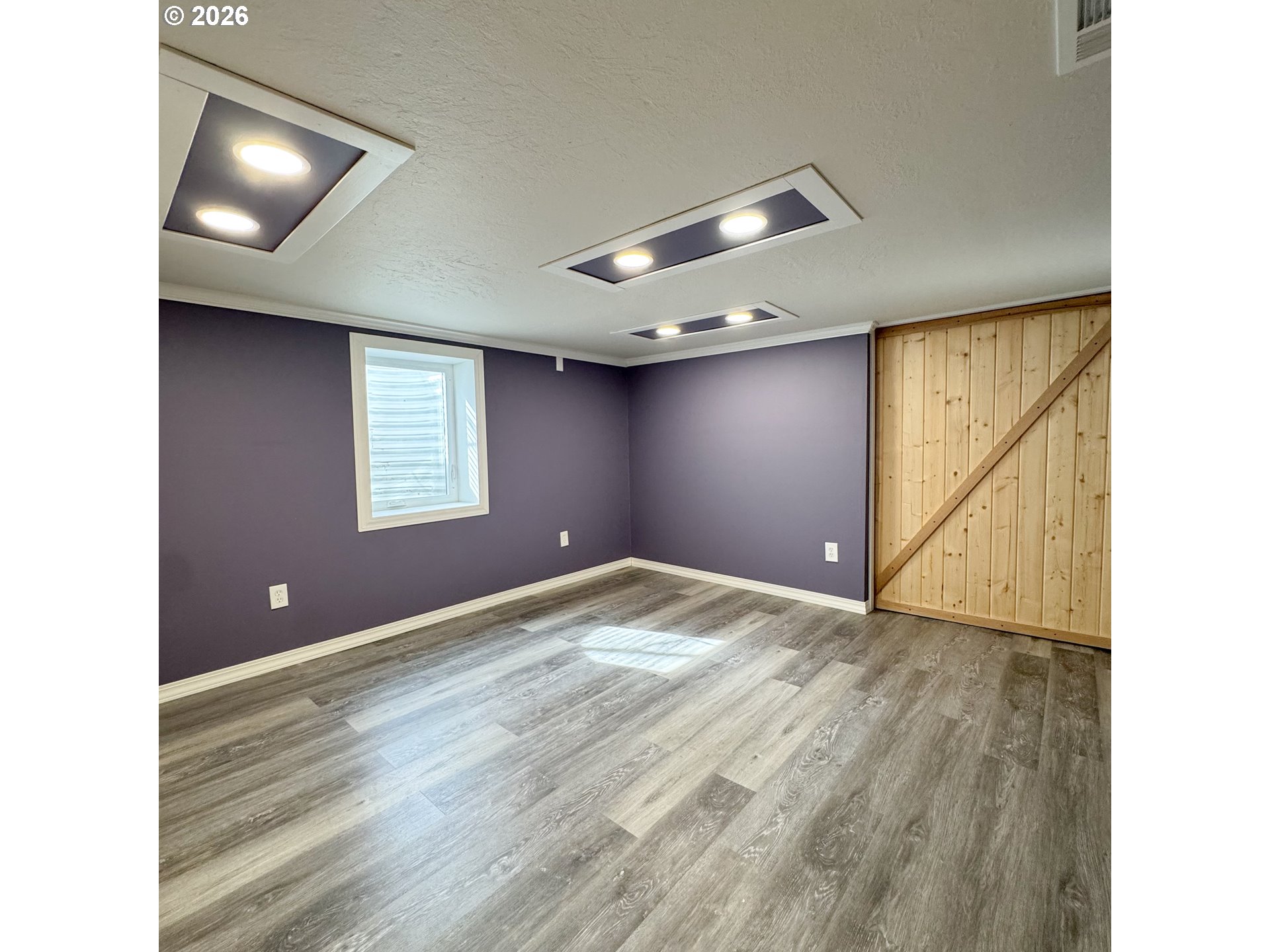 2414 3rd Street Baker City, OR 97814 - Photo 15 of 23 a view of an empty room with window and stairs