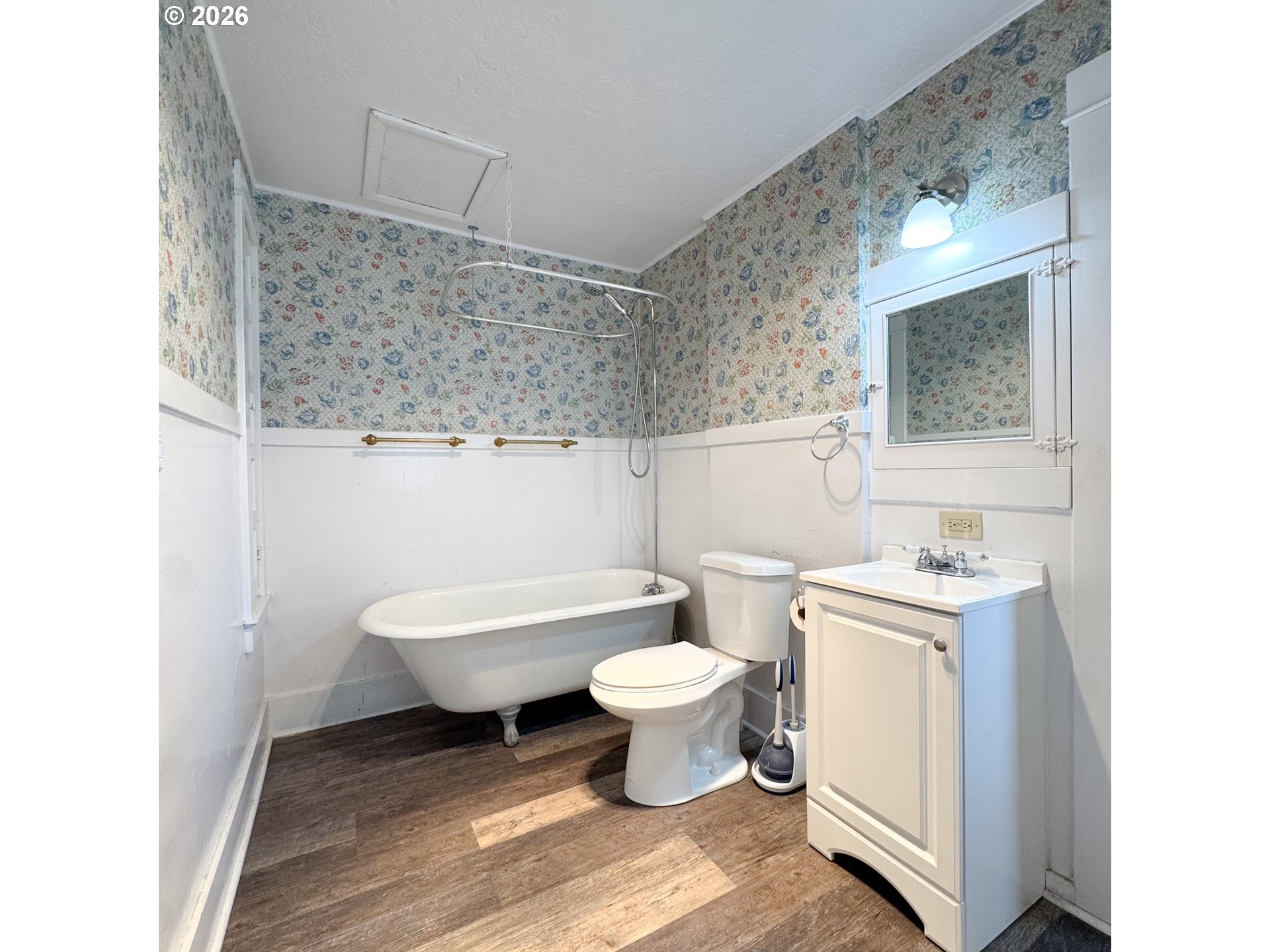 2414 3rd Street Baker City, OR 97814 - Photo 8 of 23 a bathroom with a toilet sink and mirror