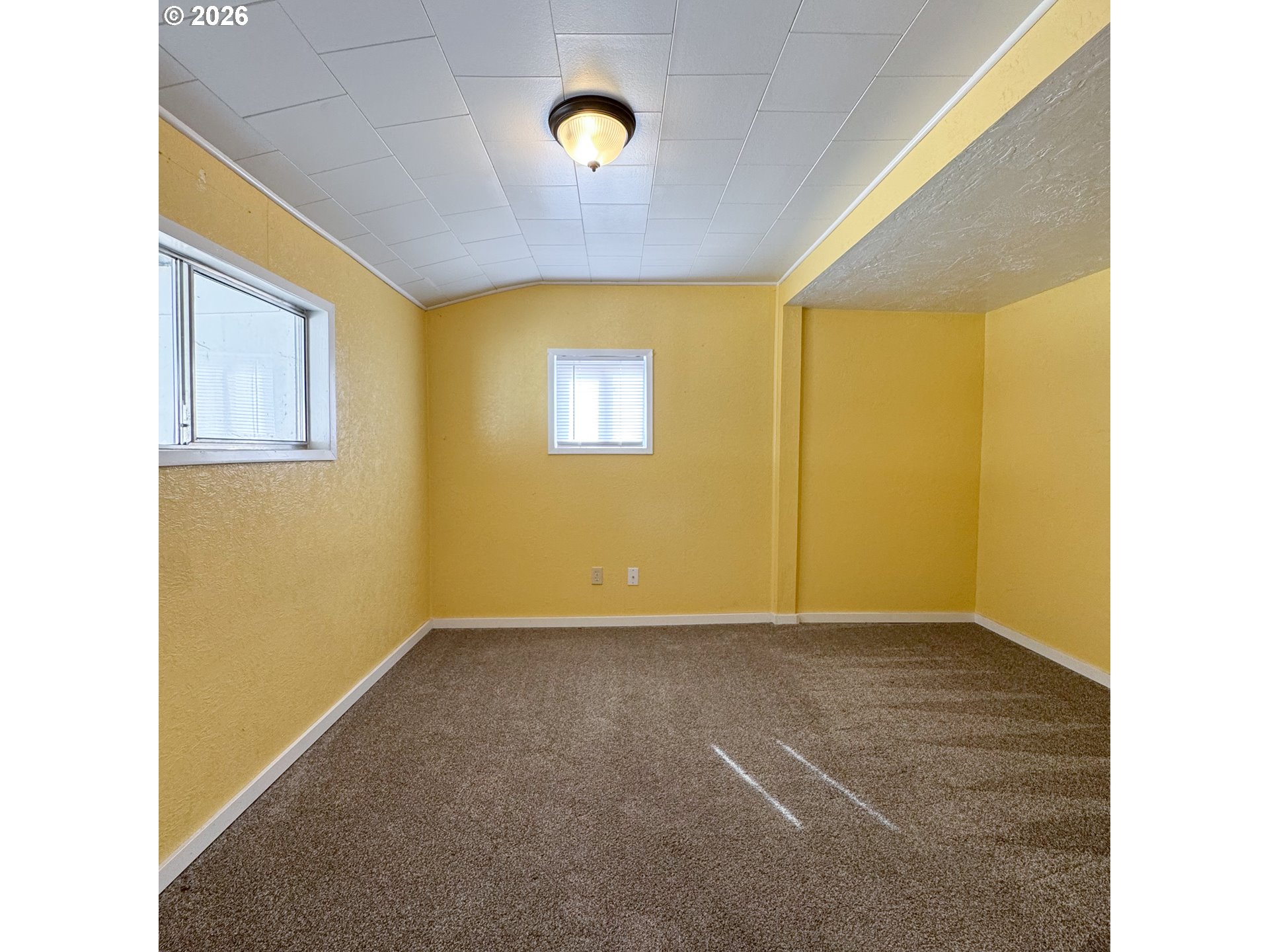 2414 3rd Street Baker City, OR 97814 - Photo 10 of 23 a view of an empty room with a window