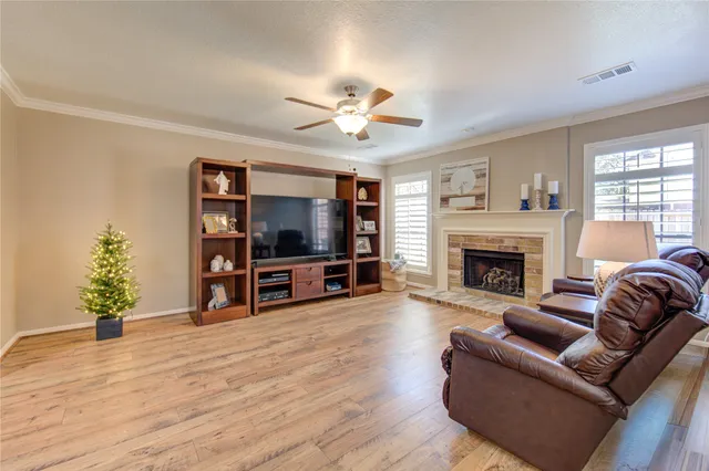 a view of a livingroom with furniture and a flat screen tv