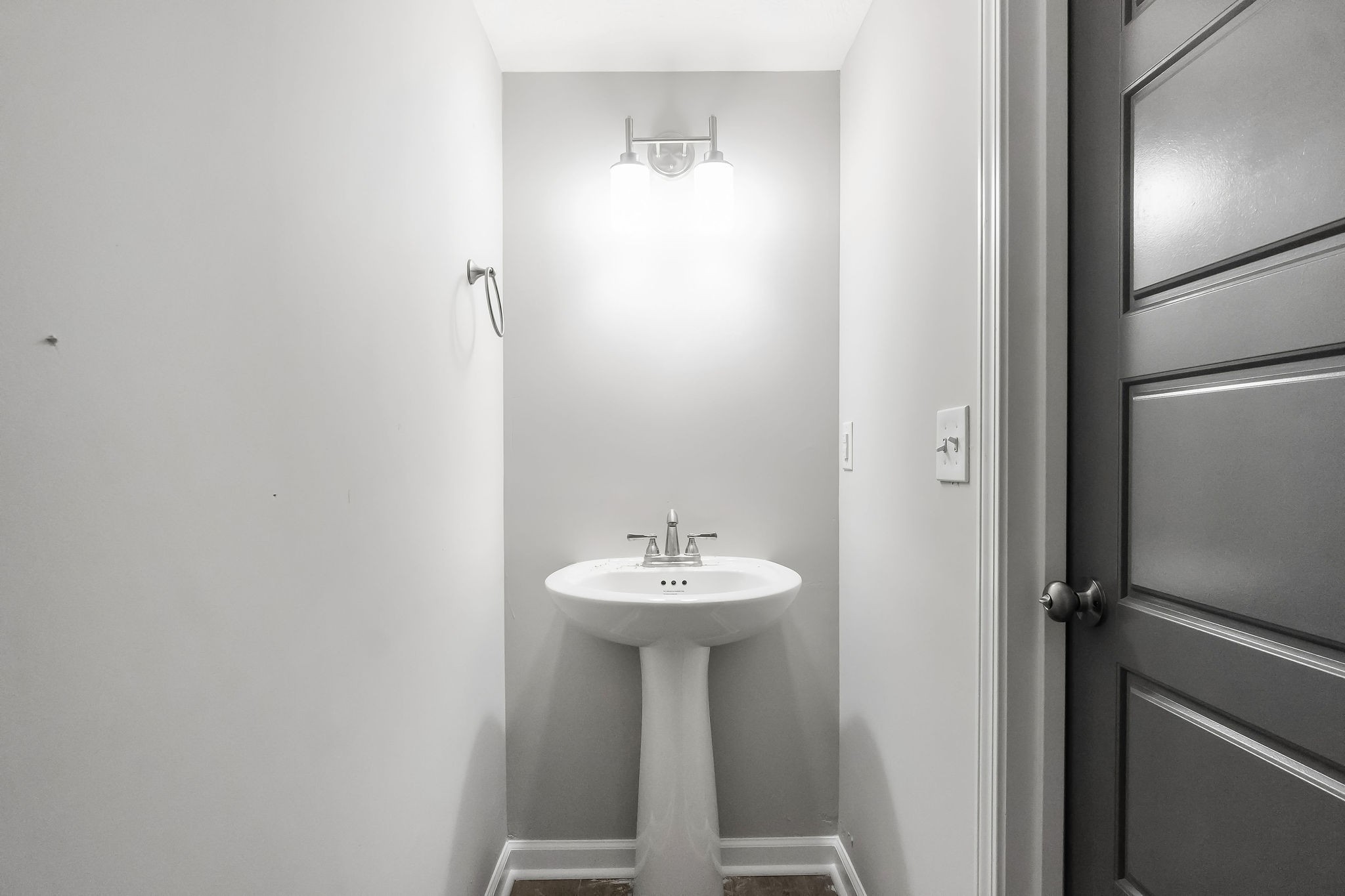 301 Longshadow Trail, Unit B Clarksville, TN 37043 - Photo 11 of 29 a bathroom with a sink and a mirror