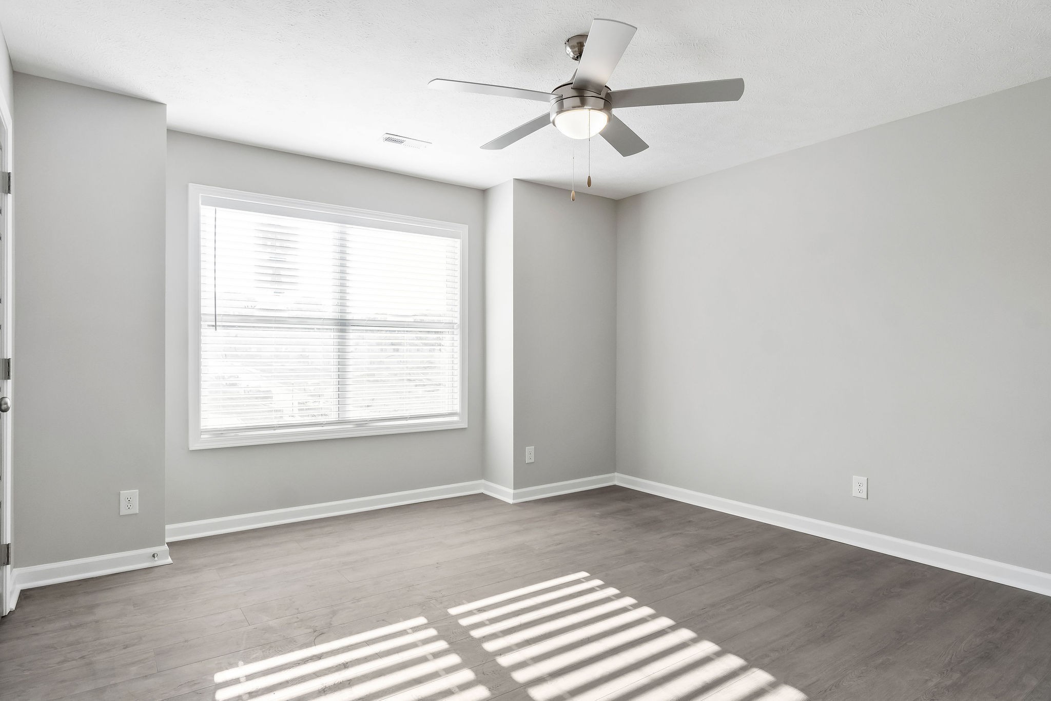 301 Longshadow Trail, Unit B Clarksville, TN 37043 - Photo 12 of 29 an empty room with a window and a ceiling fan