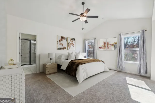 a bathroom with a granite countertop bathtub shower sink and mirror