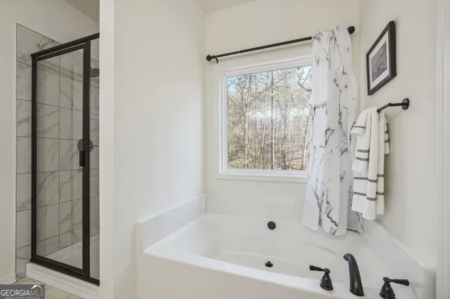 a bedroom with a bed and a dresser with the shoe rack