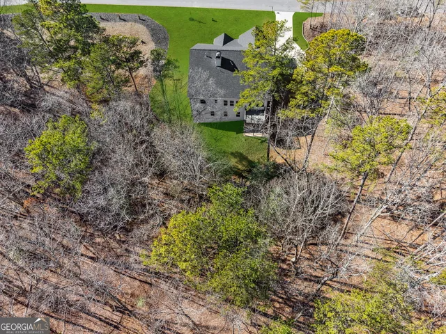 a aerial view of a house with a yard