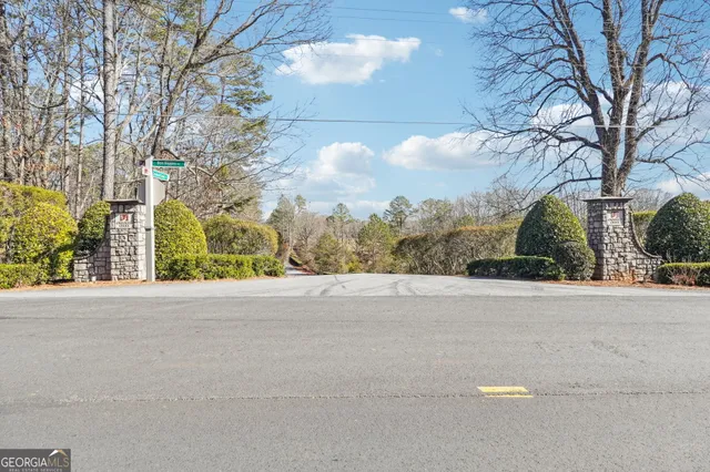a view of fountain in middle of the green field