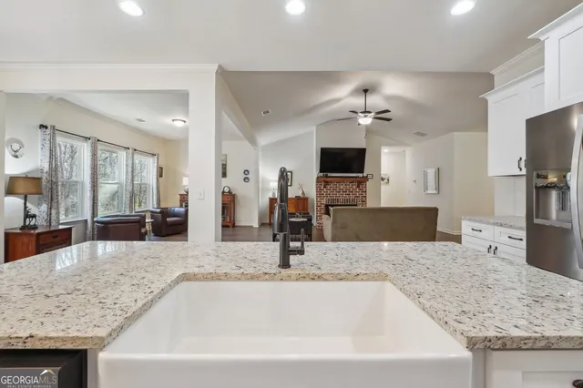 a view of kitchen island with furniture wooden floor and dining table