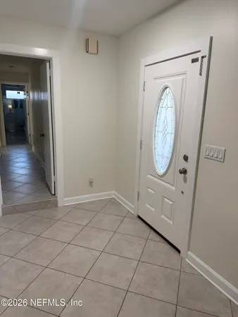 an empty room with mirror