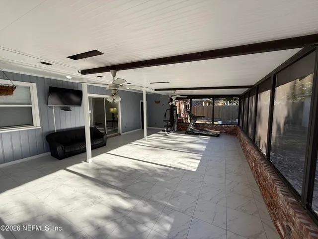 a view of lobby with furniture and a large window