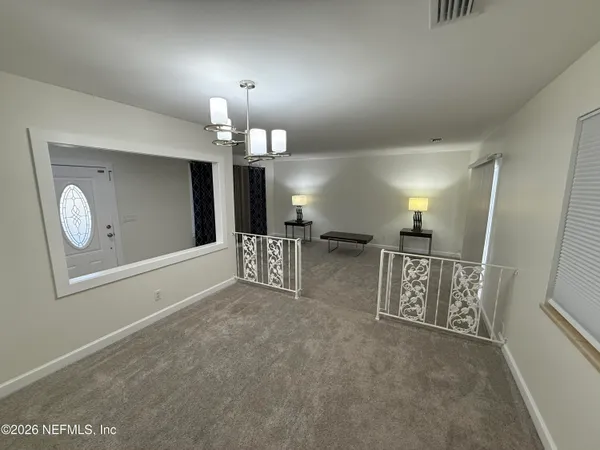 a view of a hallway with elevator