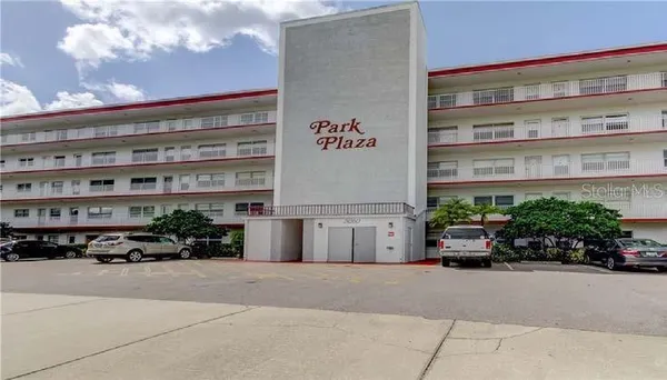 a building with potted plants in front of it