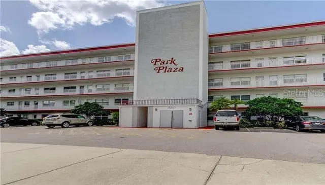 a building with potted plants in front of it