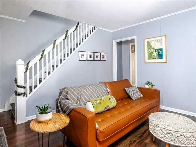 a living room with furniture and a table