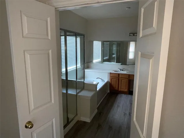 a kitchen with stainless steel appliances a sink and a refrigerator