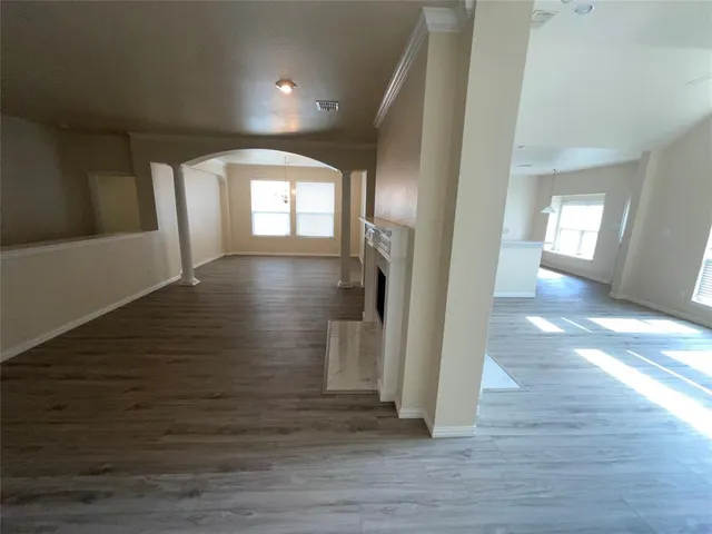 a view of hallway with wooden floor