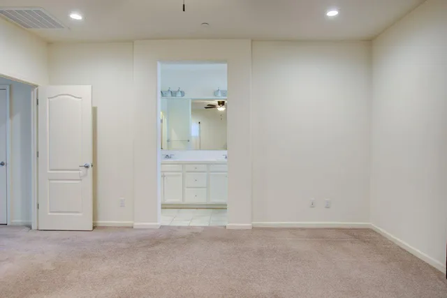 an empty room with windows and entrance