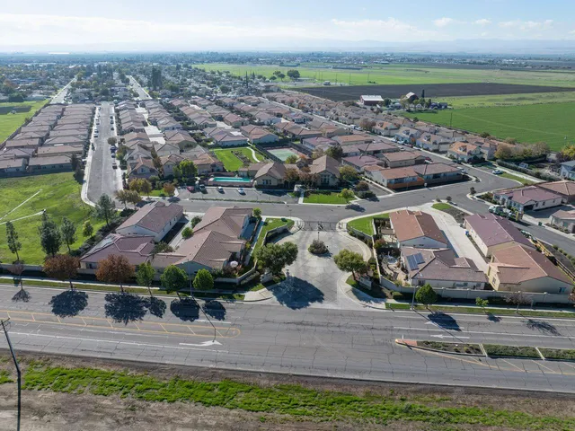 an aerial view of a house with a garden