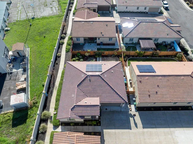 an aerial view of a house with a garden