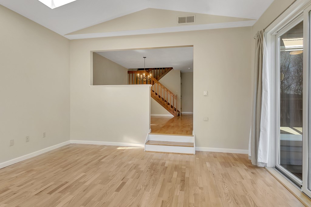 307 Ridgefield Circle, Unit A Clinton, MA 01510 - Photo 16 of 42 a view of empty room with wooden floor and fan