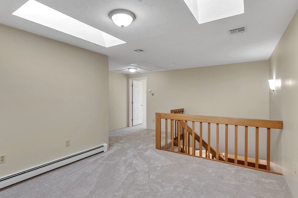 307 Ridgefield Circle, Unit A Clinton, MA 01510 - Photo 21 of 42 a view of a hallway with a projector