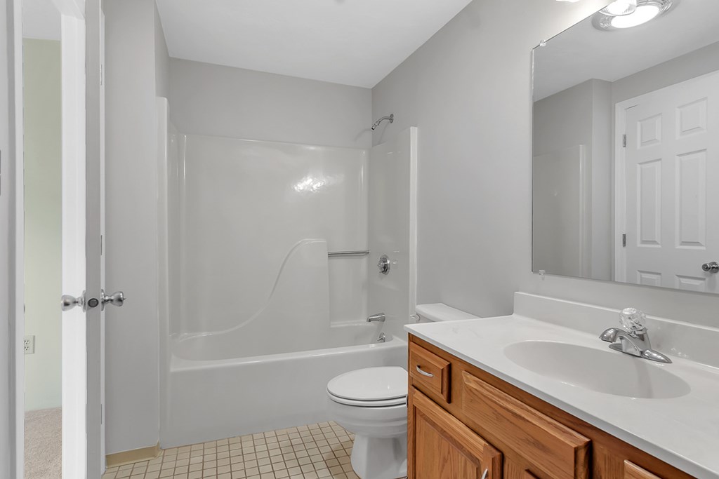 307 Ridgefield Circle, Unit A Clinton, MA 01510 - Photo 23 of 42 a bathroom with a sink a toilet and shower