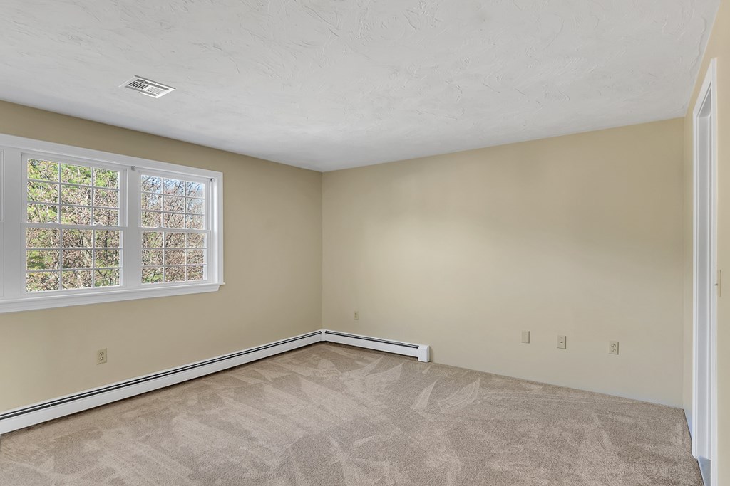 307 Ridgefield Circle, Unit A Clinton, MA 01510 - Photo 24 of 42 an empty room with a window