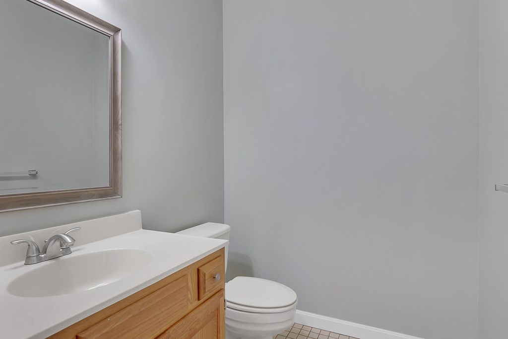 307 Ridgefield Circle, Unit A Clinton, MA 01510 - Photo 33 of 42 a bathroom with a sink a toilet and vanity