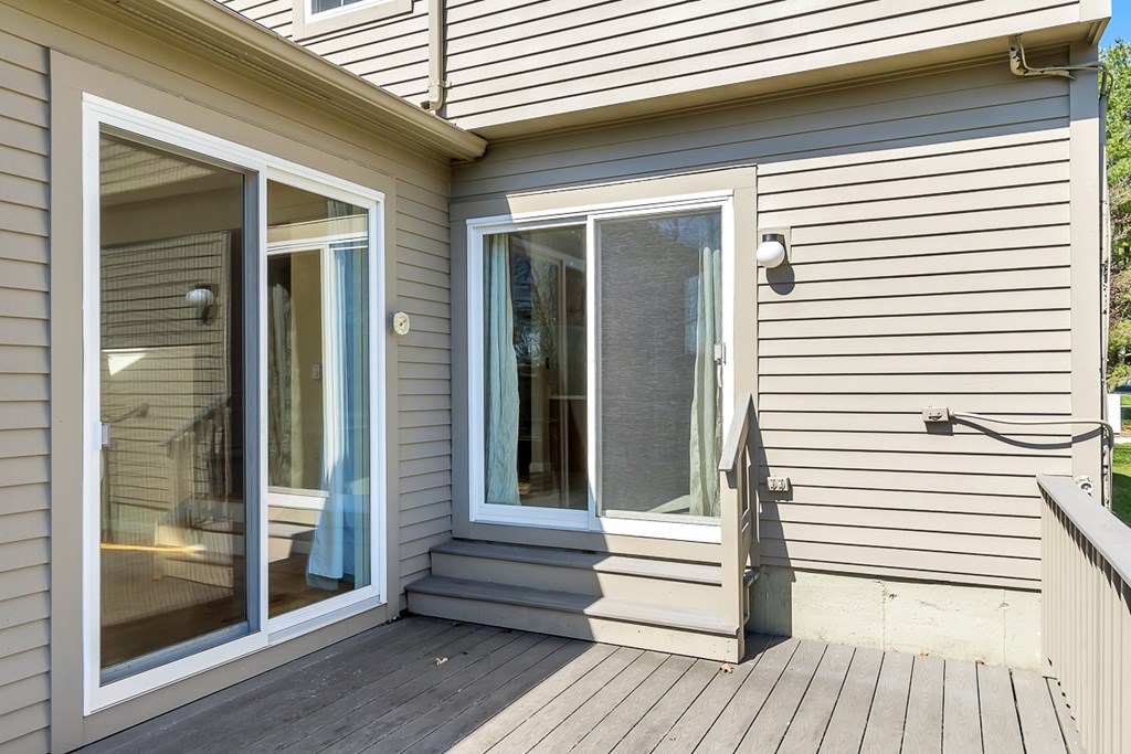 307 Ridgefield Circle, Unit A Clinton, MA 01510 - Photo 34 of 42 a view of a balcony with door and wooden floor