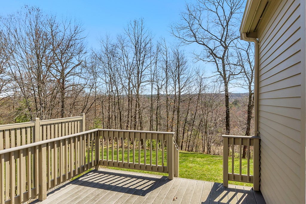 307 Ridgefield Circle, Unit A Clinton, MA 01510 - Photo 35 of 42 a view of a wooden deck with a yard