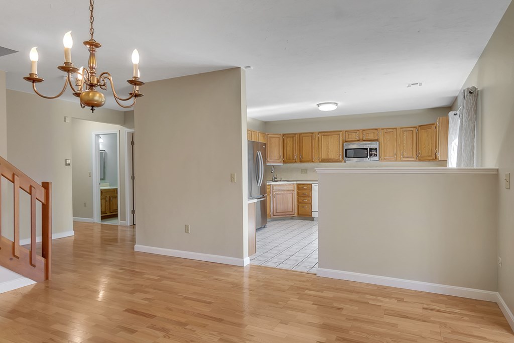 307 Ridgefield Circle, Unit A Clinton, MA 01510 - Photo 9 of 42 a view of a livingroom with a chandelier