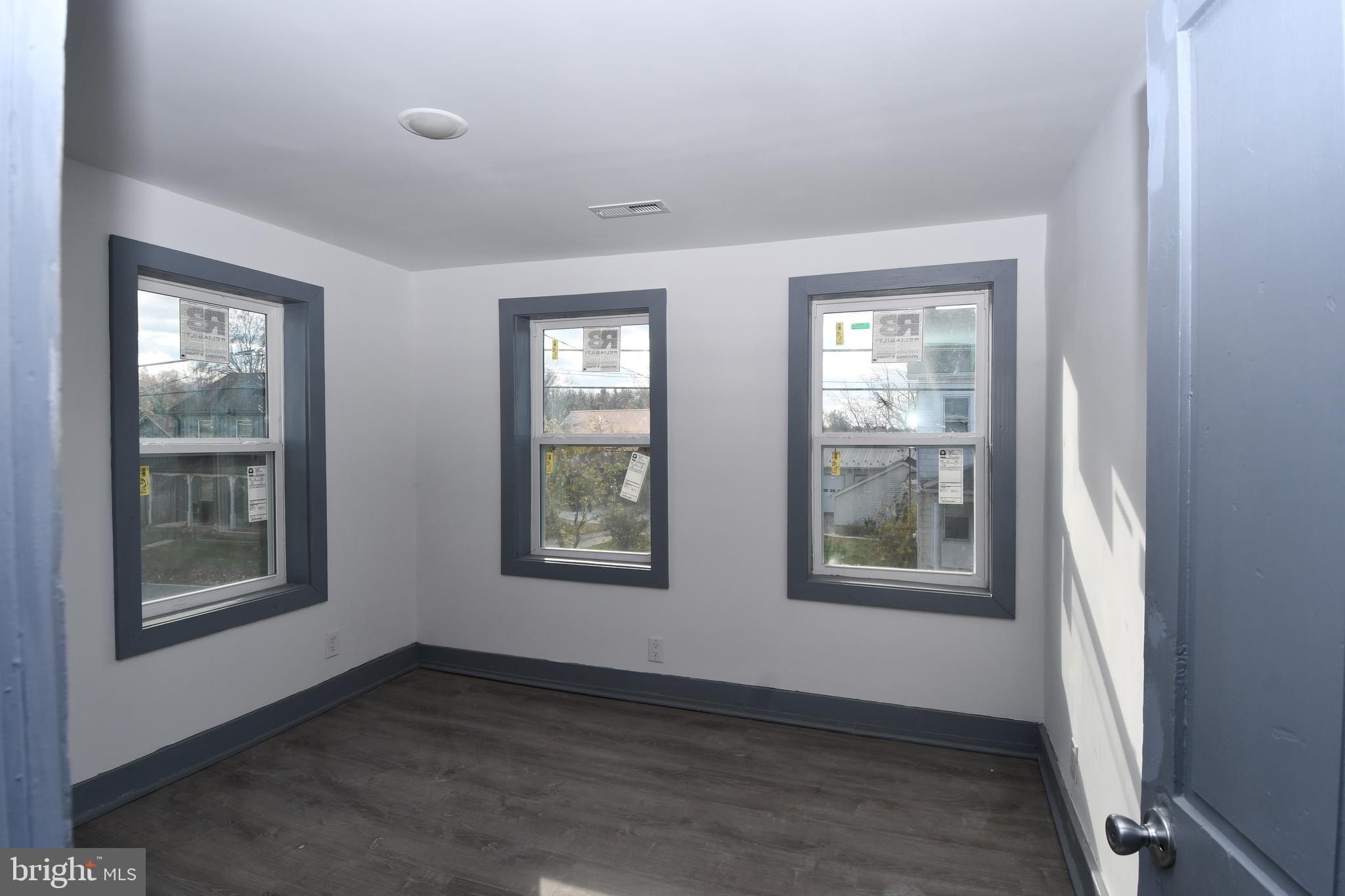 780 White Hall Road Littlestown, PA 17340 - Photo 13 of 19 a view of an empty room with a window and wooden floor