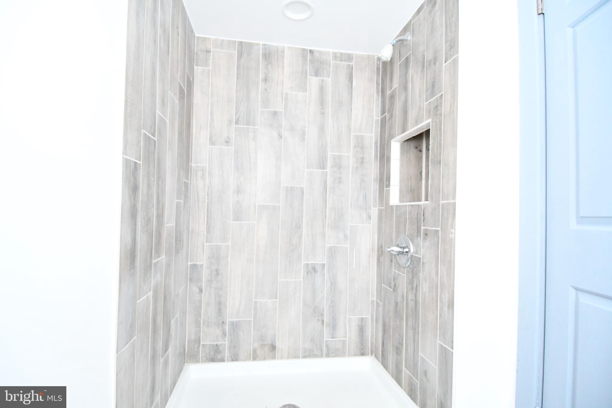 780 White Hall Road Littlestown, PA 17340 - Photo 17 of 19 a bathroom with a shower curtain and a curtain