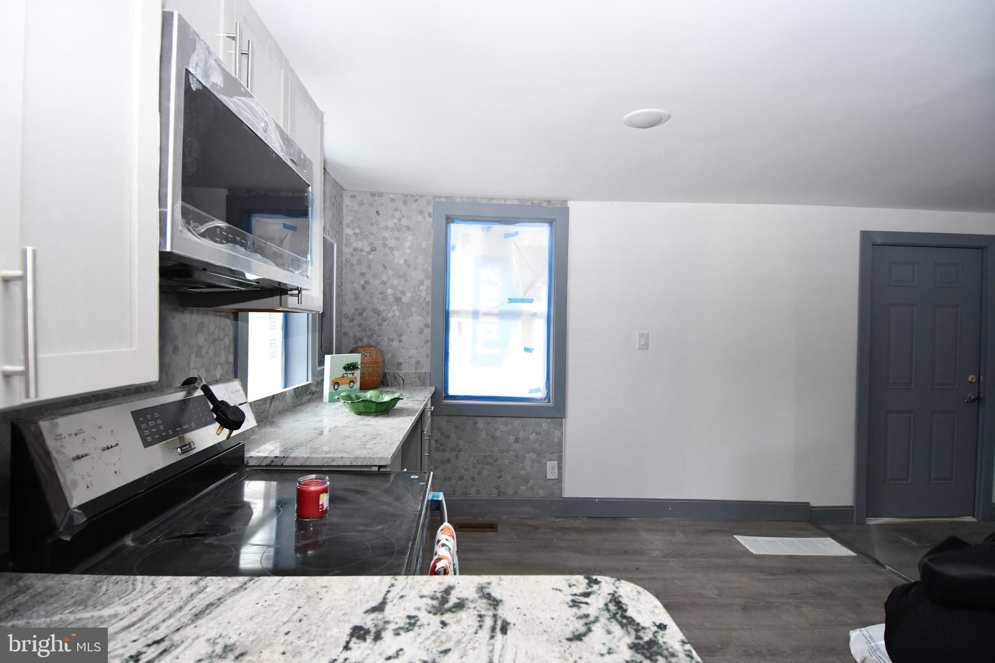 780 White Hall Road Littlestown, PA 17340 - Photo 2 of 19 a living room with furniture and a fireplace