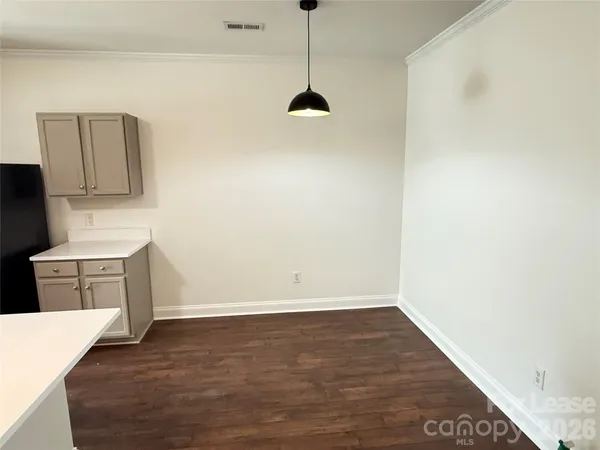 a view of a kitchen with a sink dishwasher and a microwave