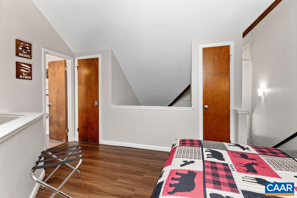 487 3 Ridges Roseland, VA 22967 - Photo 18 of 20 a bedroom with a bed and a wooden floor