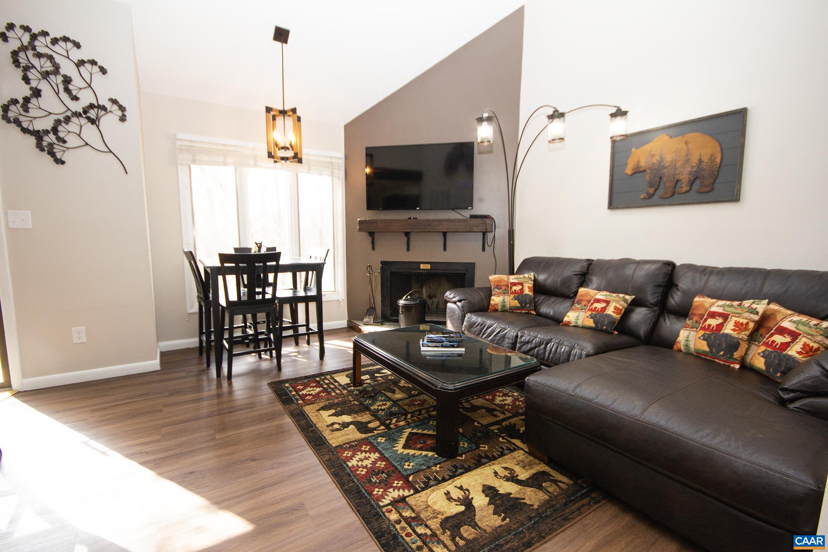 487 3 Ridges Roseland, VA 22967 - Photo 3 of 20 a living room with furniture and a fireplace