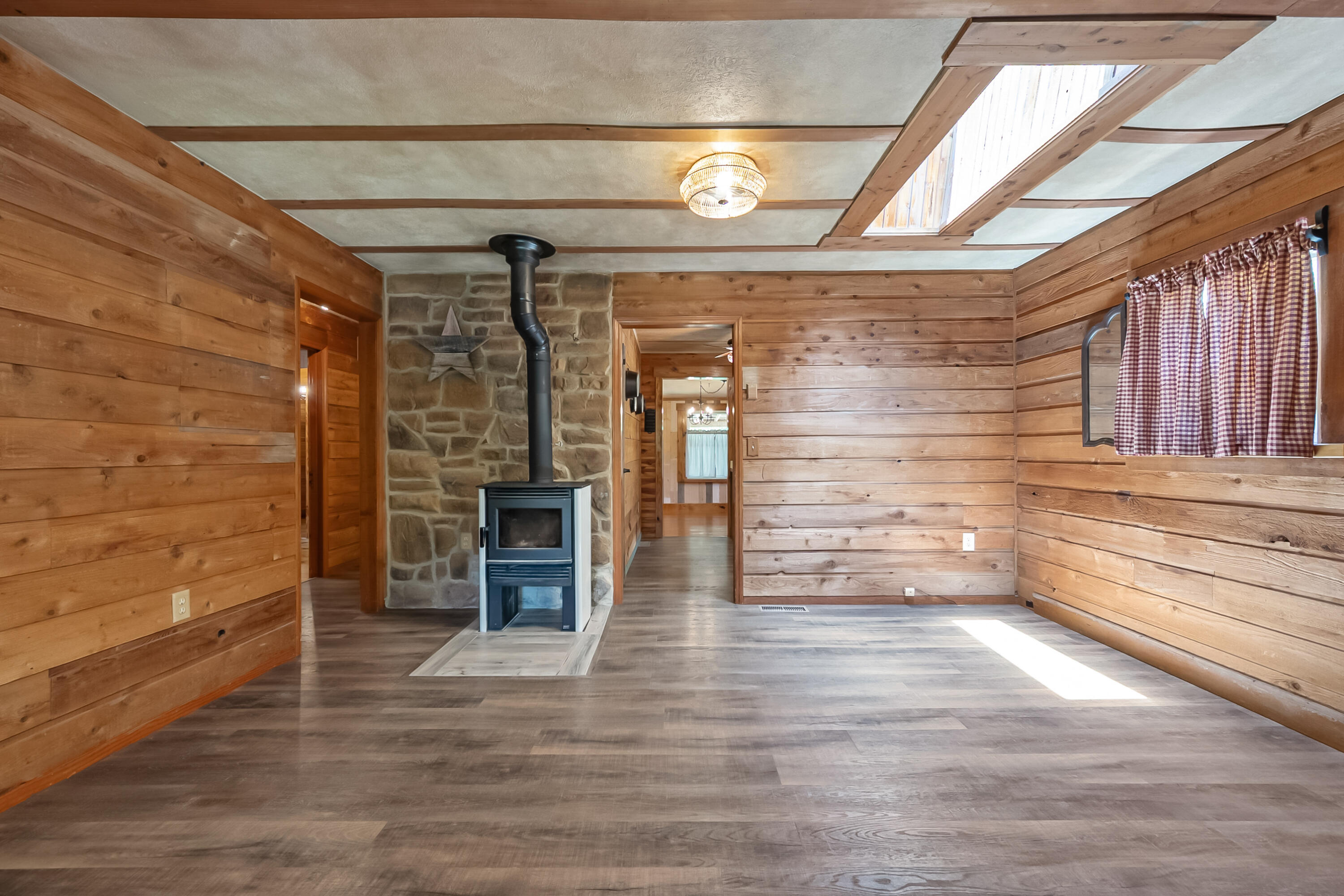 2389 Reesedale Road Elliston, VA 24087 - Photo 12 of 62 a view of a livingroom with wooden floor and a fireplace