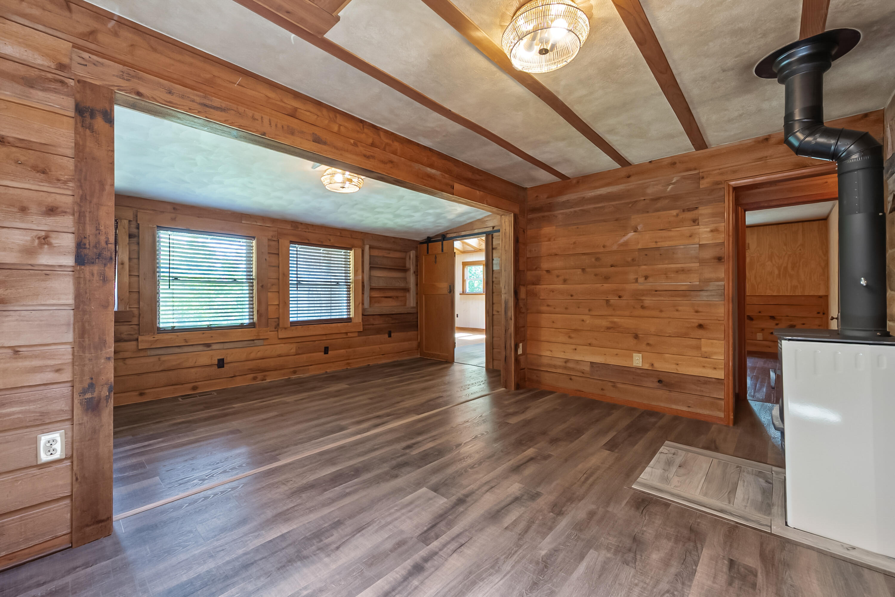 2389 Reesedale Road Elliston, VA 24087 - Photo 14 of 62 a view of an empty room with wooden floor and a window