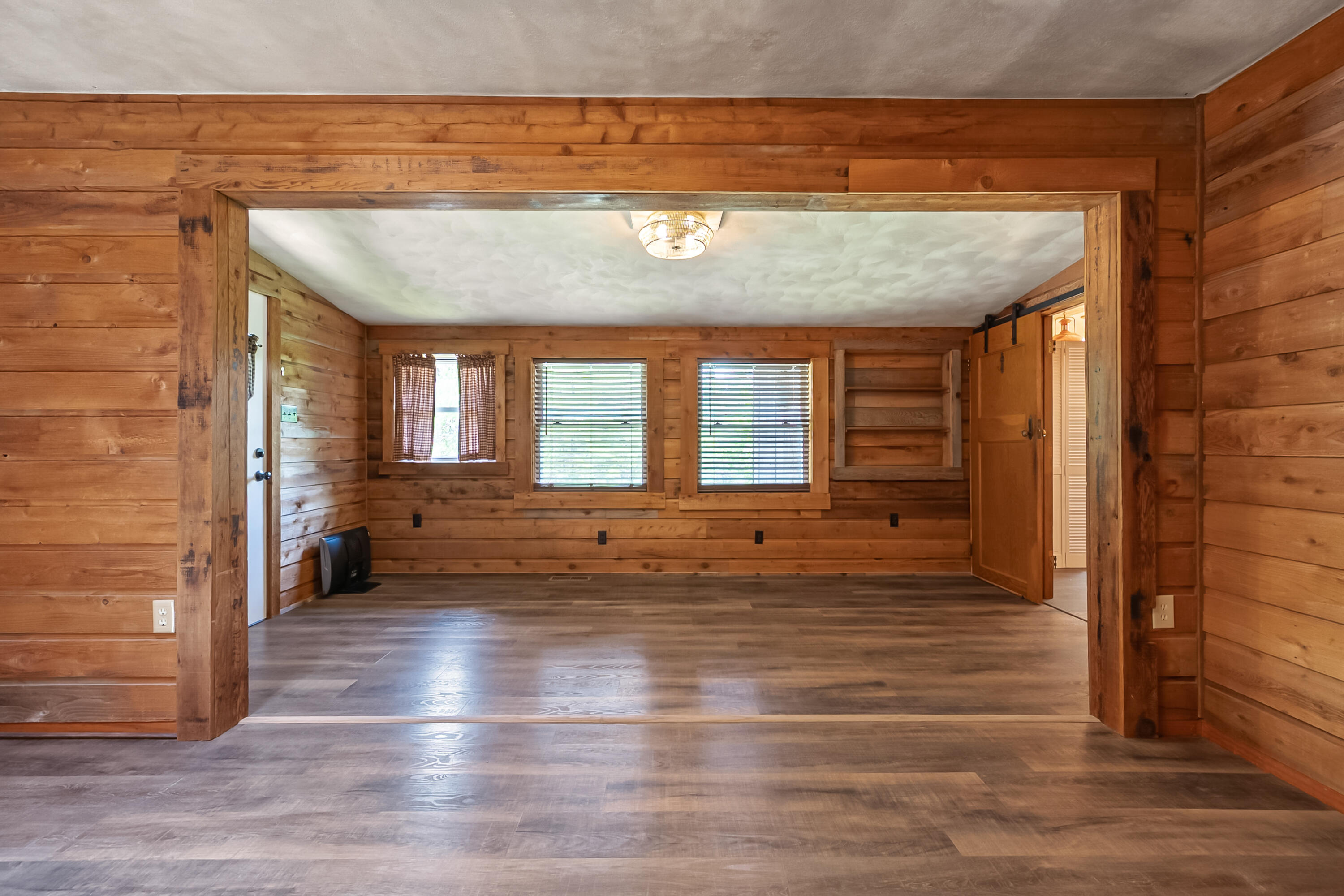 2389 Reesedale Road Elliston, VA 24087 - Photo 15 of 62 a view of empty room with wooden floor and fan