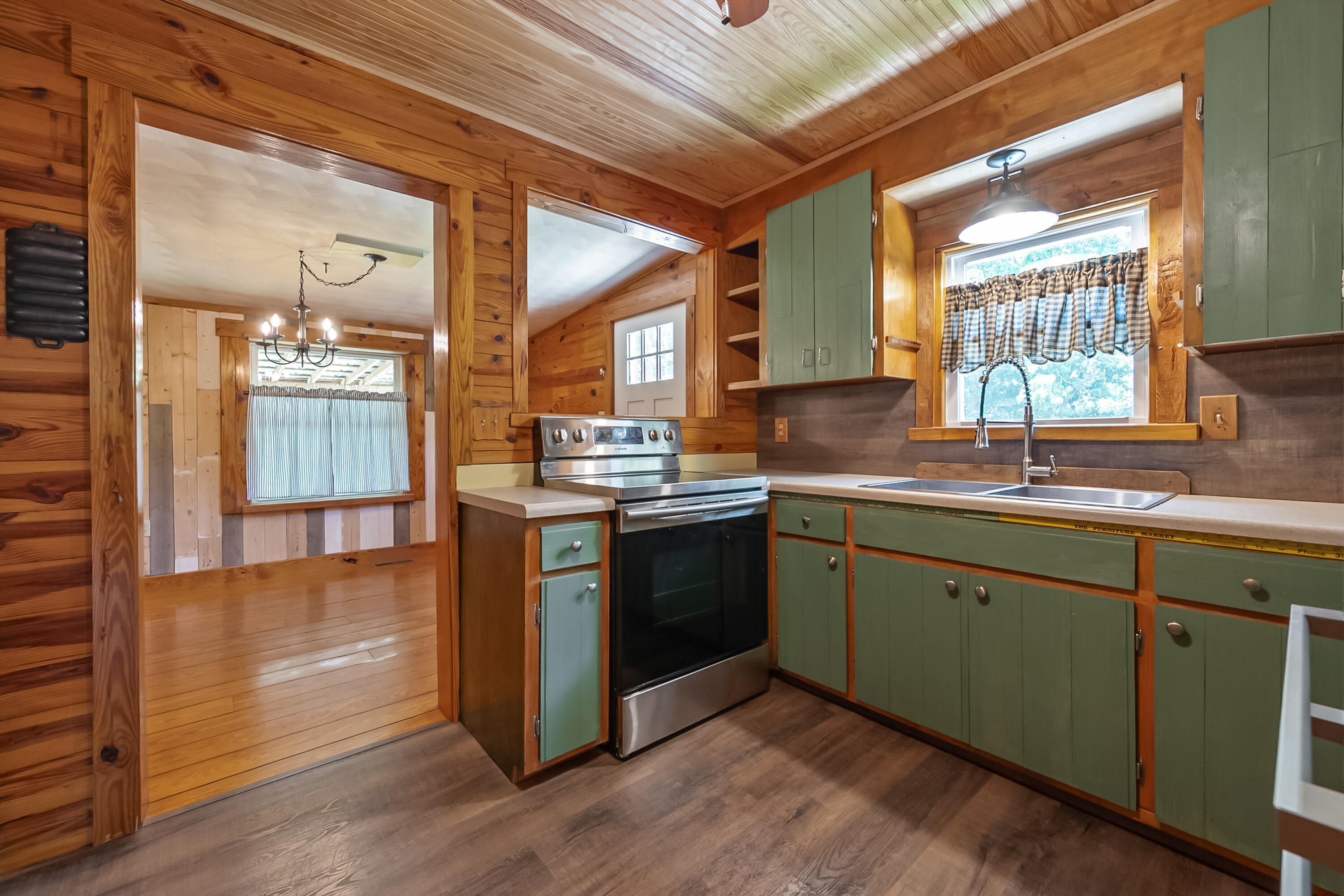 2389 Reesedale Road Elliston, VA 24087 - Photo 16 of 62 a kitchen with granite countertop a sink cabinets and wooden floor