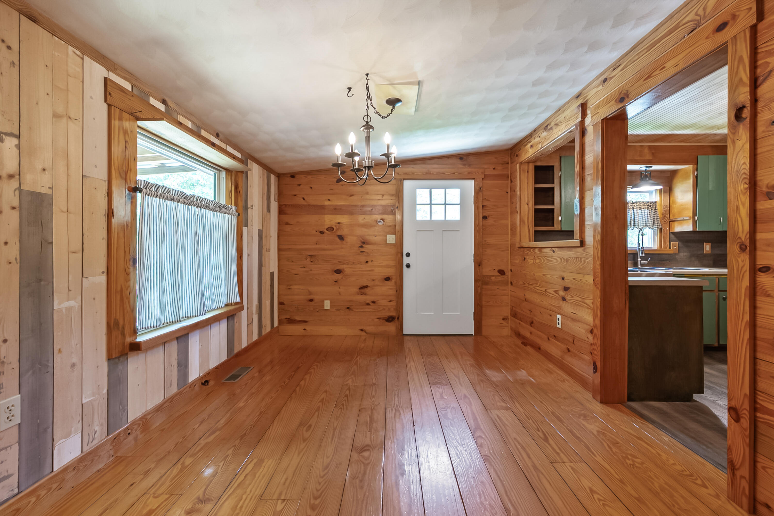 2389 Reesedale Road Elliston, VA 24087 - Photo 19 of 62 a view of a hallway with wooden floor and staircase