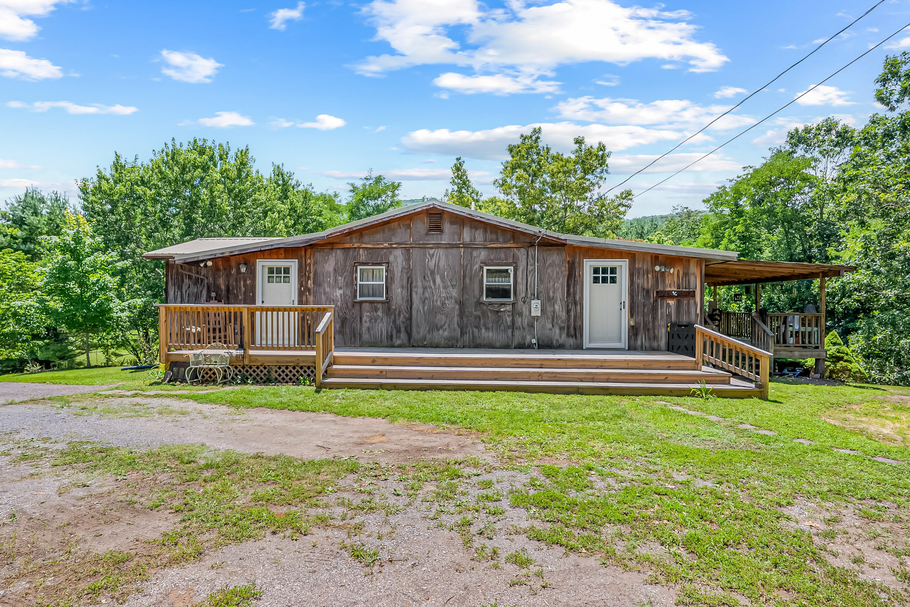 2389 Reesedale Road Elliston, VA 24087 - Photo 2 of 62 a view of a house with pool and chairs