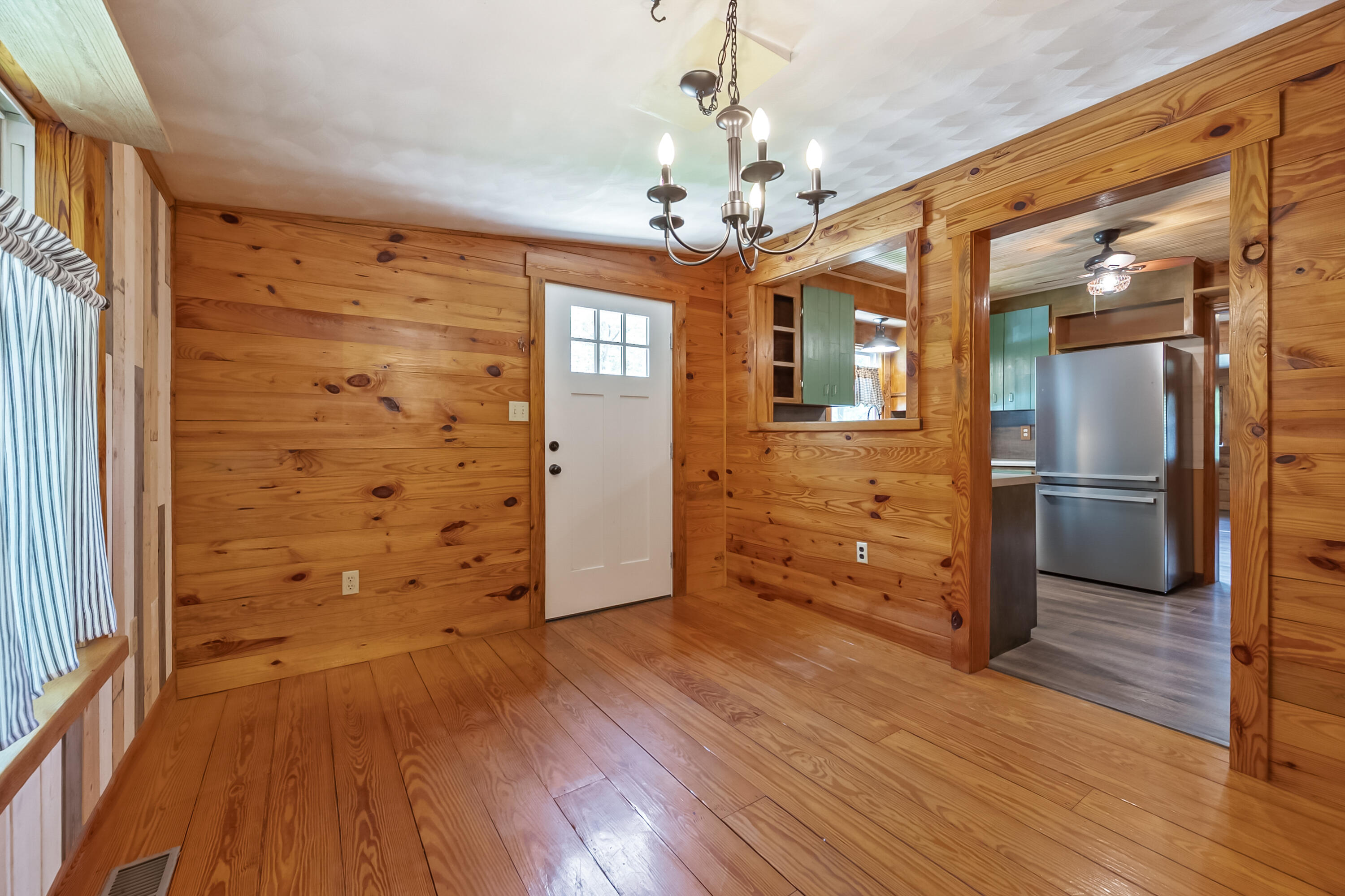 2389 Reesedale Road Elliston, VA 24087 - Photo 20 of 62 a view of a hallway with wooden floor and staircase